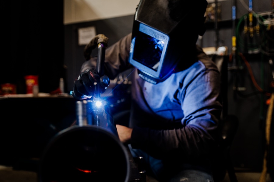 Welder working on a custom weld for a customer