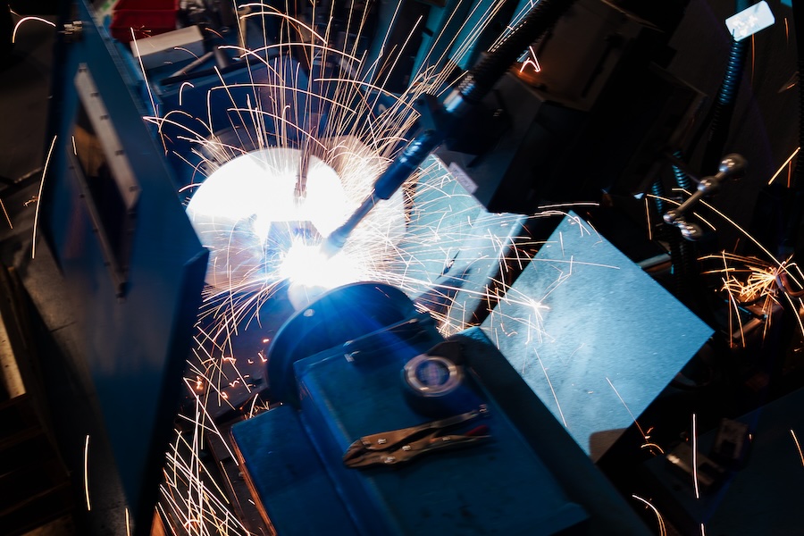 Sparks flying from the dual head welding machine.