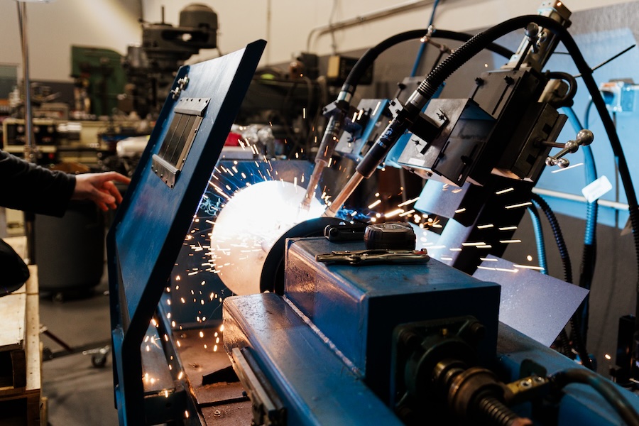 Dual head welding machine in process.